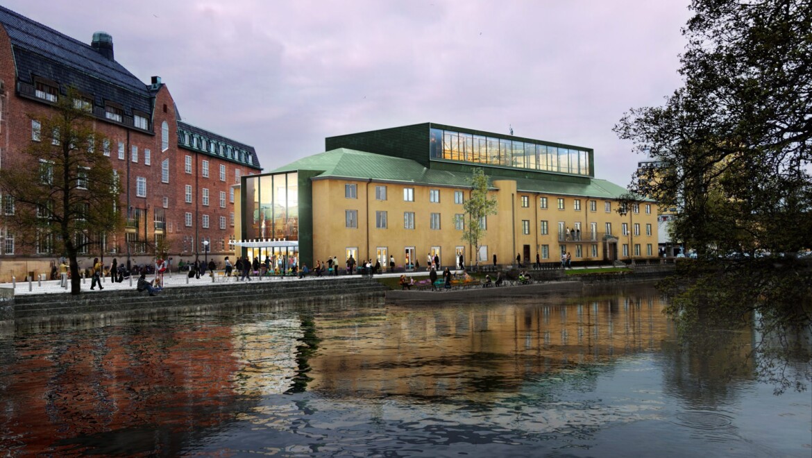 Örebro Konserthus, en gul stenbyggnad som ligger intill Svartån. Himlen skimrar i rosa och många människor står framför husets entré.